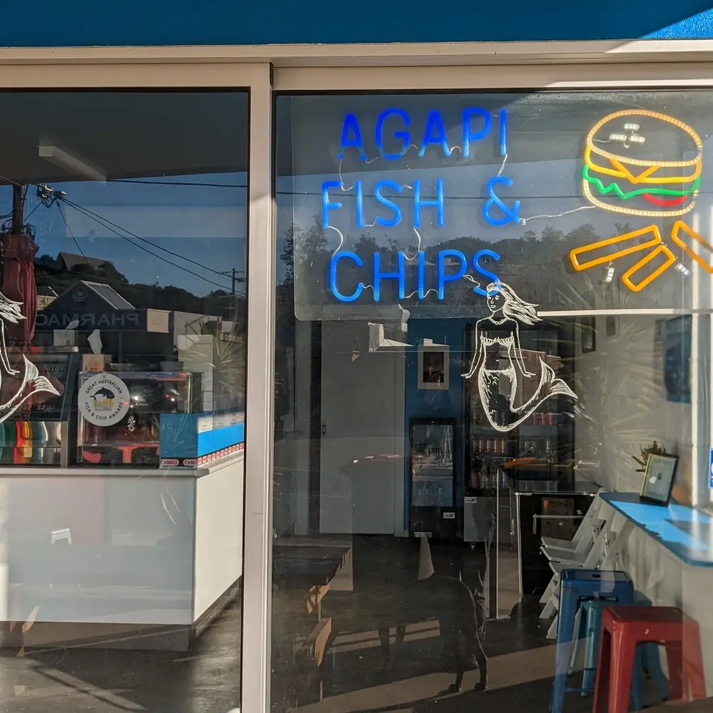 Agapi Fish and Chips restaurant facade and signage saying burgers souvlaki and the phone number 56637743