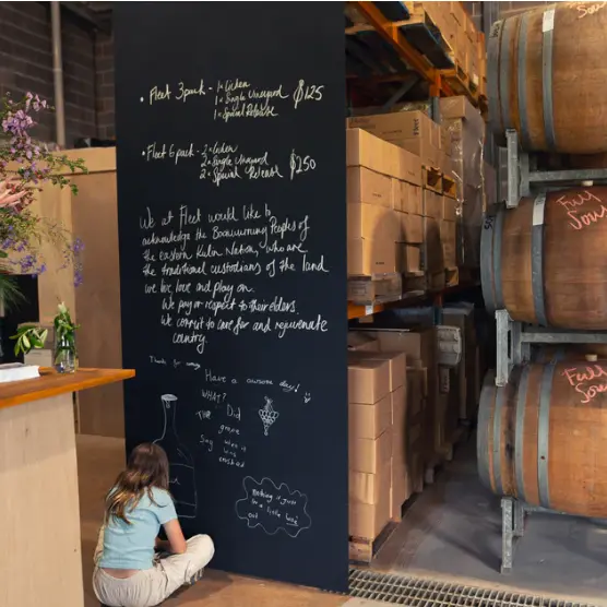 Image of stacked barrels in the cellar door at Fleet Wines